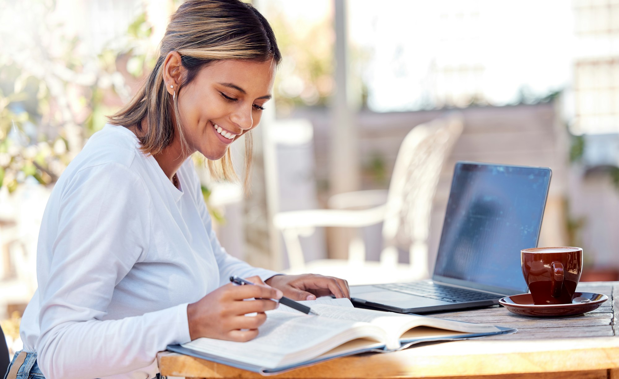 Woman, reading textbook, student and education with smile, study and academic course, learning and